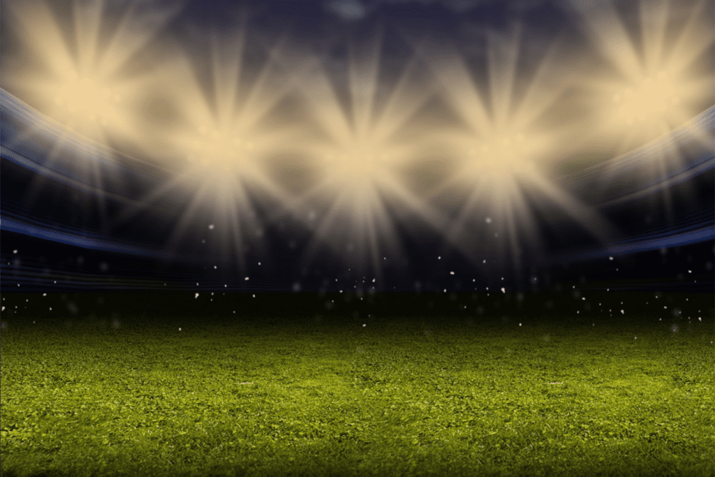 the glow of stadium lights at night
