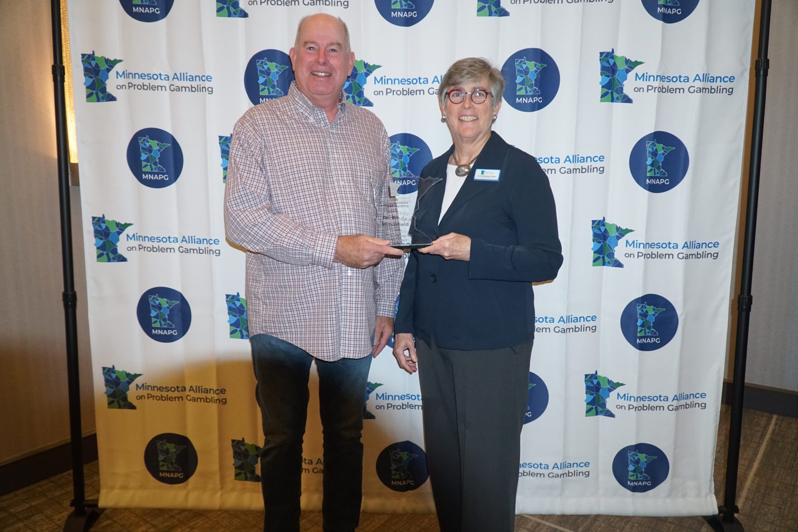 Randy Stinchfield accepts the 2024 MNAPG Service Award.